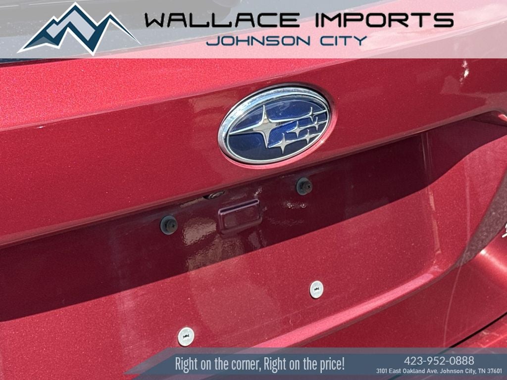 2025 Subaru Outback Limited in Crimson Red Pearl — front three-quarter view