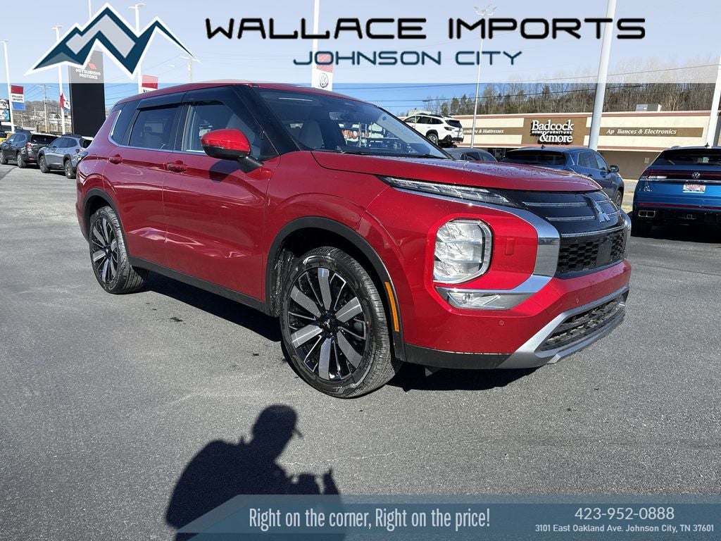 2025 Mitsubishi Outlander SE in Red Diamond — front three-quarter view