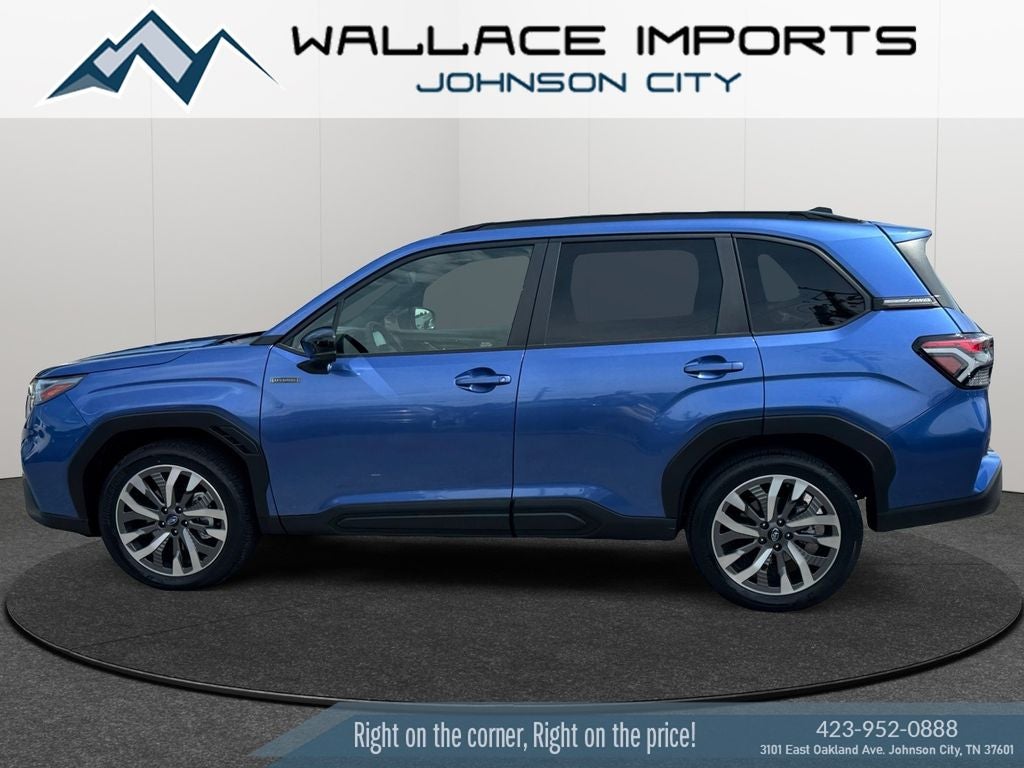 2025 Subaru Forester Hybrid Touring in Daybreak Blue Pearl — front three-quarter view